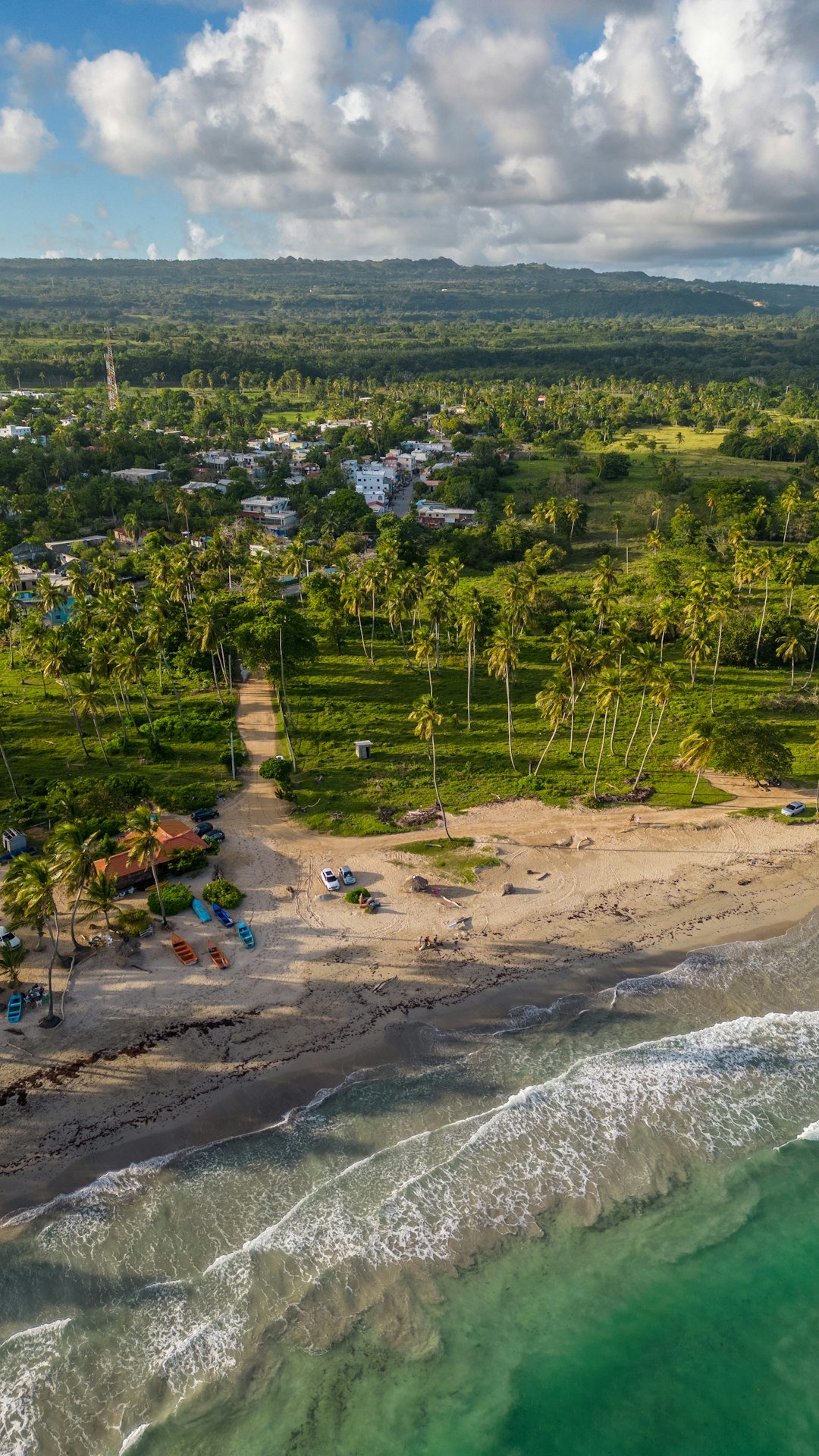 an aerial view of a beach and a resort